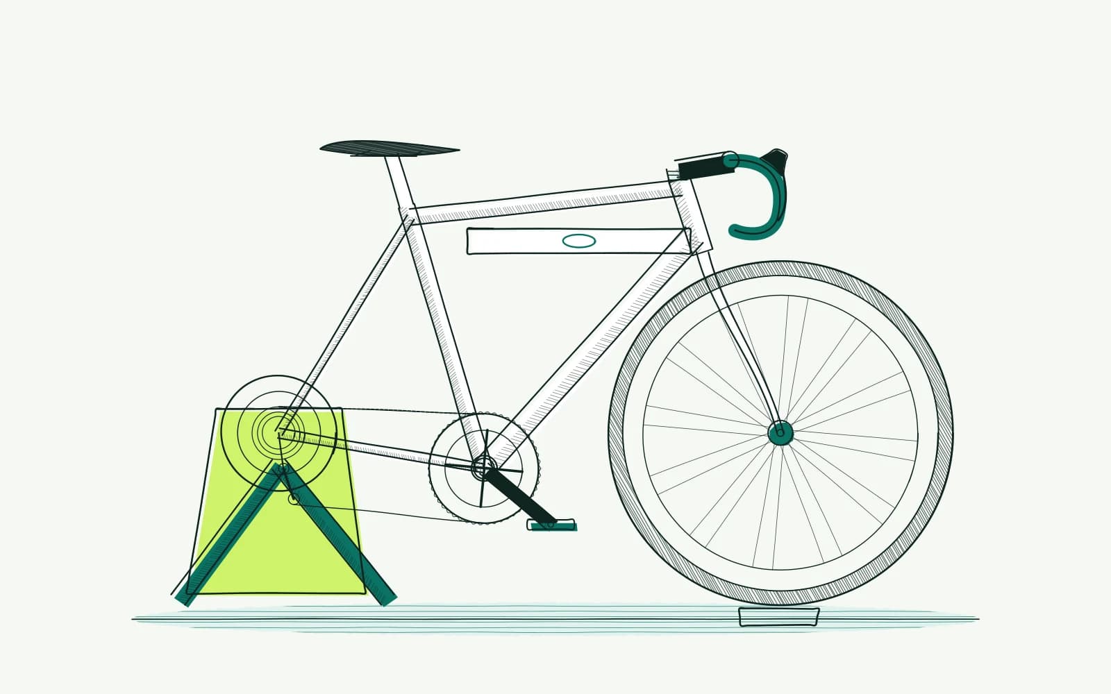 Fiets op een trainer met voorwielsteun en waterpas, zodat de stand van de hele fiets eerst gecontroleerd wordt.